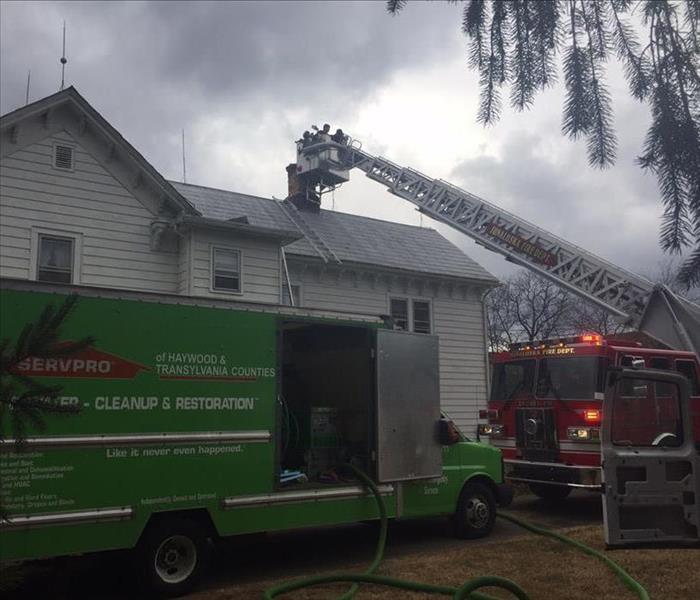 Firefighters and SERVPRO arrive at a house fire